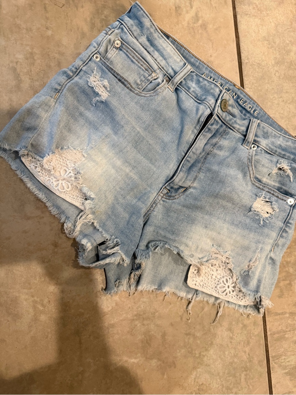 American Eagle Outfitters Pale Blue Distressed Denim Shorts with Lace Insets
